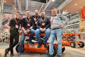 Liftroller Team Joachim Hillern, Christian Liebenberg, Ivar Ole Wik, Kim Gregersen and Bjarte Kvamme sitting on the Liftroller E Mover at their stand at the 'Bygg Reis Deg' Trade Fair in Bergen, Norway,october 2023